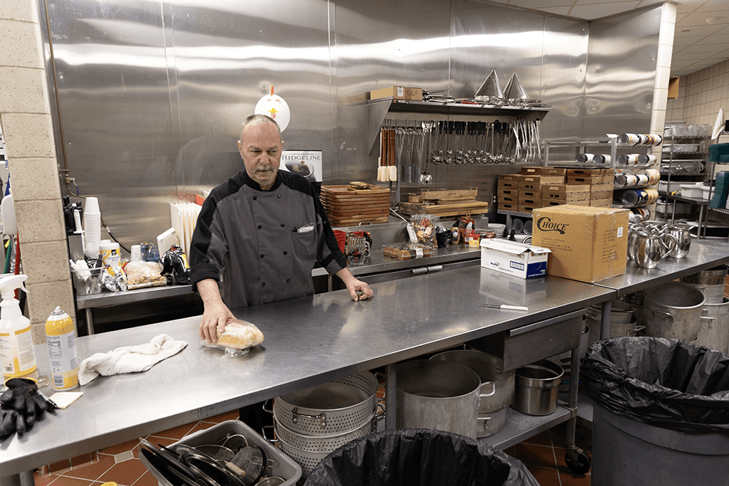 Rob Peterson, catering kitchen manager at the Ralph Engelstad Arena, works in the arena’s kitchen.